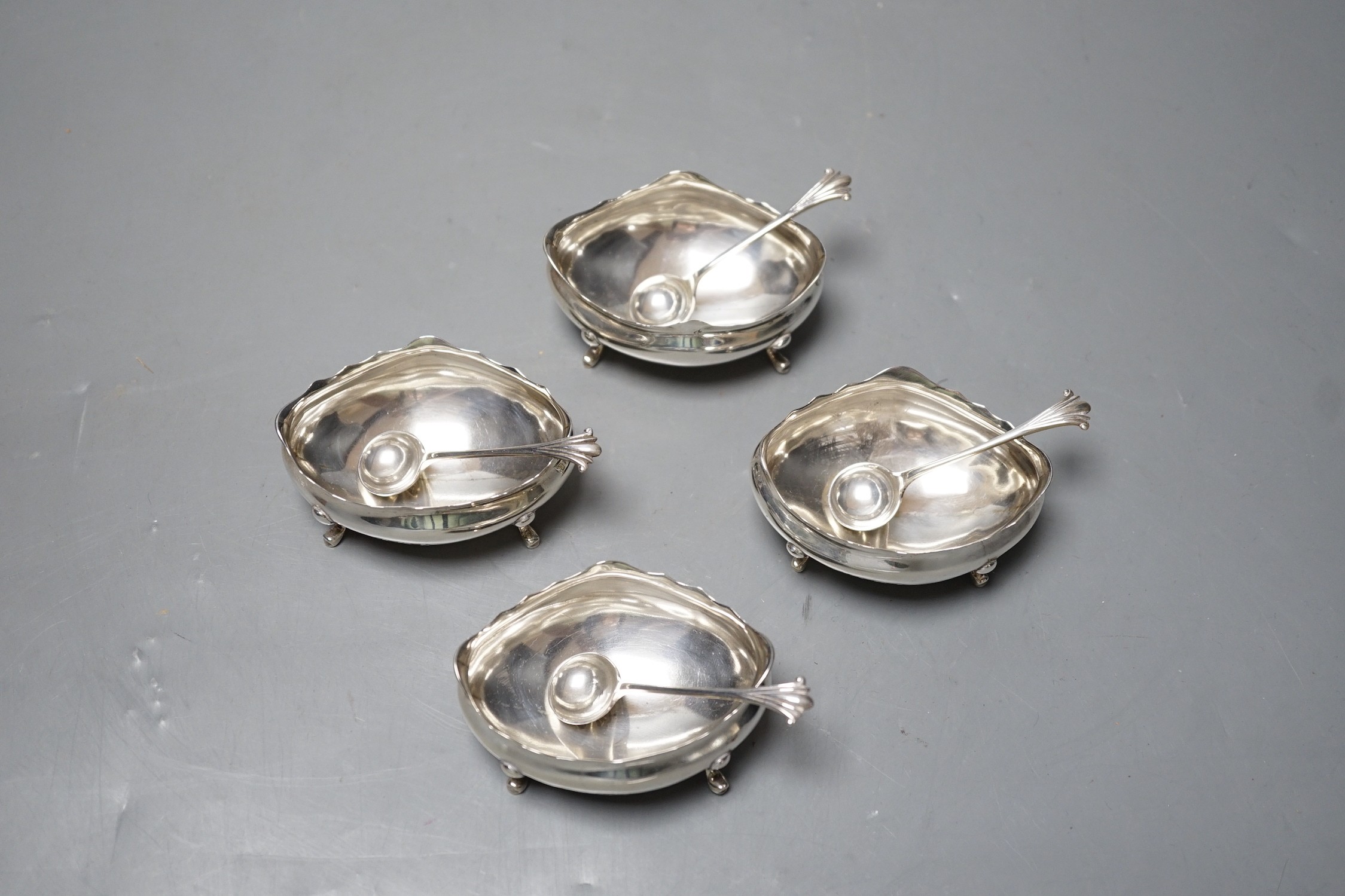 A set of four late Victorian silver oval salts and four matching spoons, Thomas Hayes, Birmingham, 1900, length 59mm.